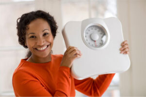 woman holding scale