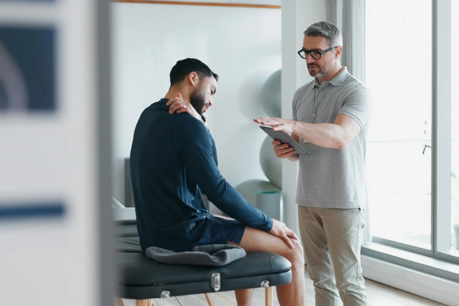 Chiropractor in Henderson consults a patient about care options for chiropractor Las Vegas and personal injury chiropractor needs.