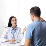 Patient describing auto accident pain during consultation with a car accident chiropractor for possible auto accident injury.