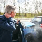 Man experiencing neck pain after car accident, a common whiplash symptom treated with car accident chiropractic care in Nevada.