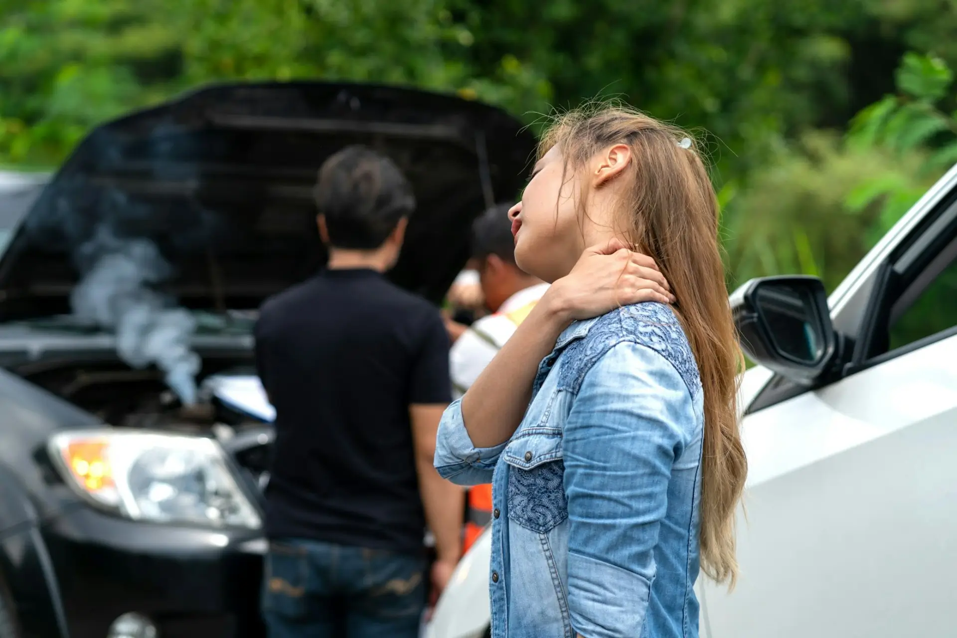woman appears to be suffering from neck pain